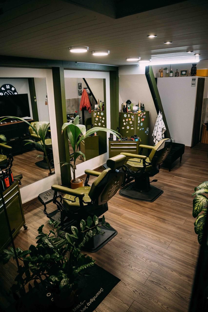 Barber working on client